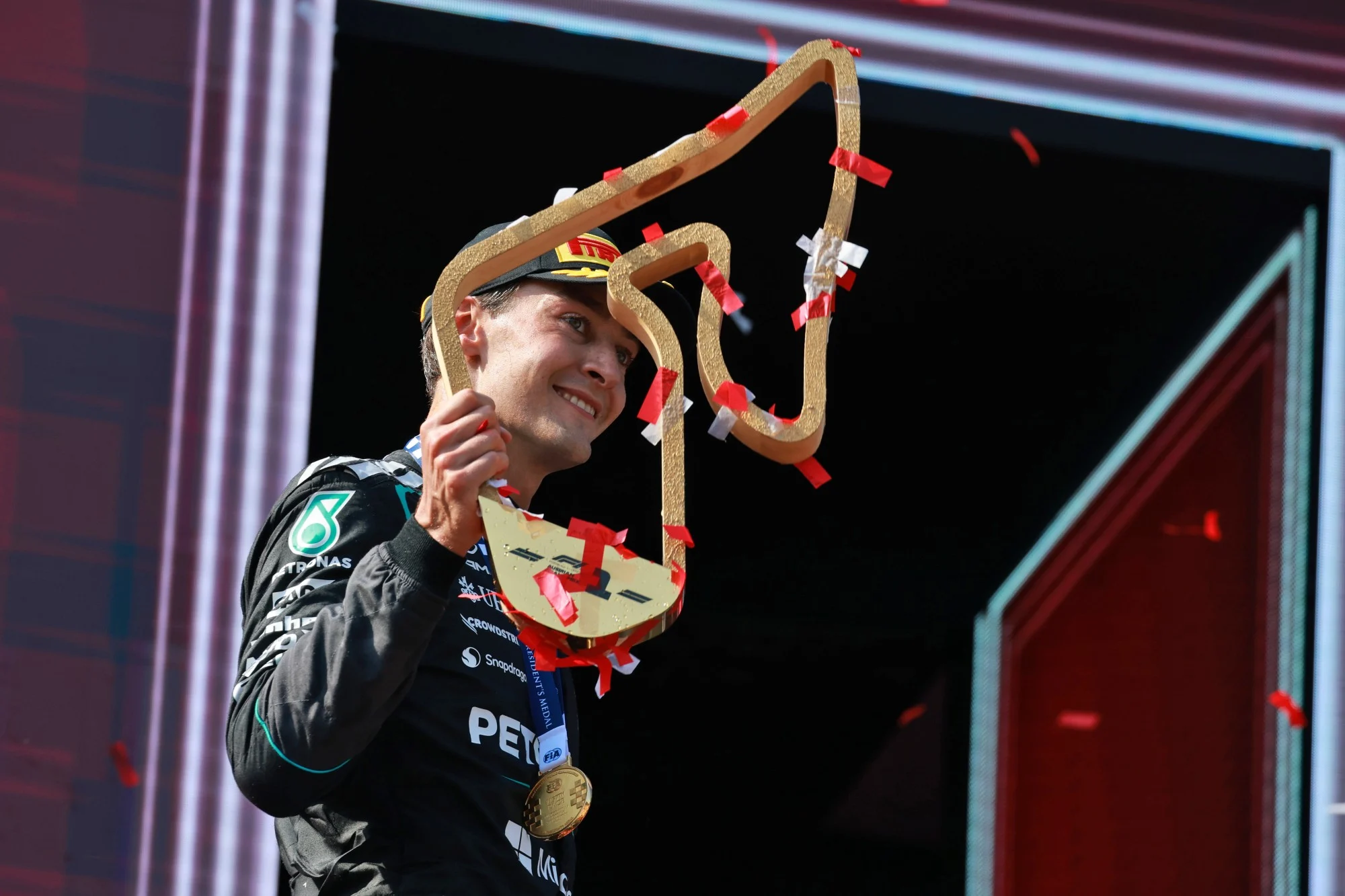 Race winner George Russell (GBR) Mercedes AMG Formula One Team celebrates on the podium.
