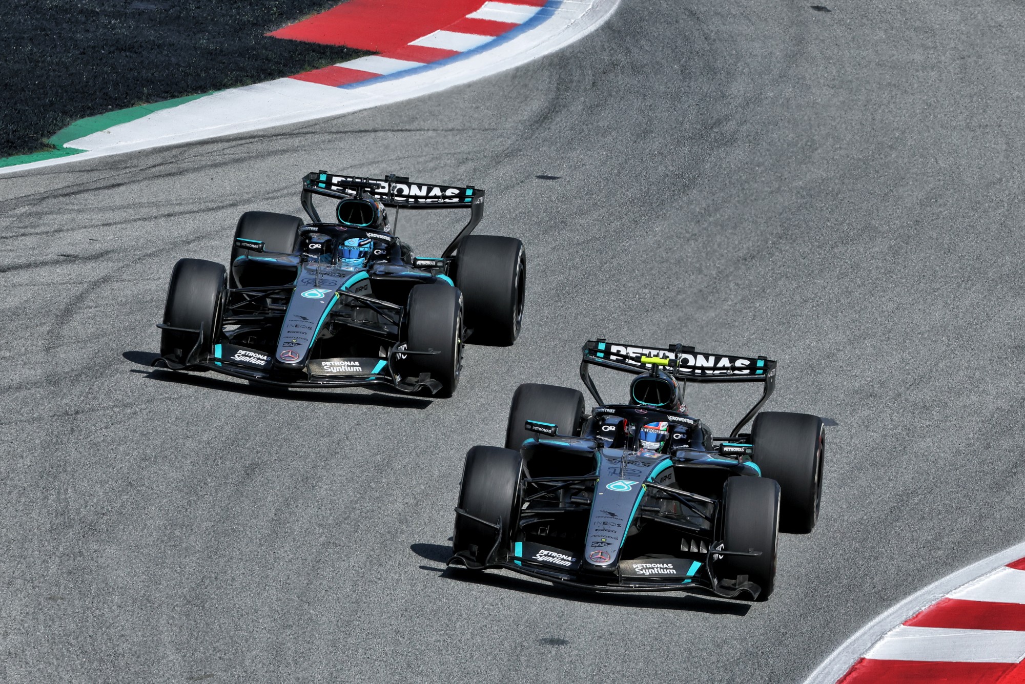Andrea Kimi Antonelli (ITA) Mercedes AMG Formula One Team W17 and George Russell (GBR) Mercedes AMG Formula One Team W17 battle for position.